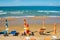 Umbrellas and chairs on sand beach of tyrrhenian sea