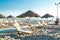 Umbrellas and chaise lounges on the beach of Rimini in Italy