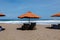 Umbrellas and empty bean bags on Berawa Beach, Bali, Indonesia