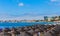 .Umbrellas on public beach in Estoril in a beautiful summer day, Portugal