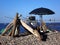 Umbrellas on a wild pebble beach