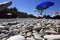 Umbrellas on a wild pebble beach