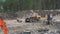 Umea, Sweden July 9, 2020: Construction of new highway - many heavy industrial machines work together - dump truck, excavators rem