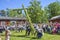 Umea, Sweden - JUNE 23, 2017 Happy people enjoying to watch pole standing moment effort by swedish people and waiting for the