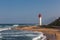 Umhlanga Rocks, South Africa, August 5, 2017: View along the beach towards the lighthouse