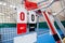 Umpire chair with scoreboard on a tennis court before the game.