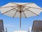 Un umbrella and sunbeds on your private beach