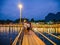 Unacquainted People on the wooden bridge with beautiful view of Nam Song River in vangvieng Lao.