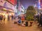 Unacquainted street performers singing and wearing traditional tribe shirt at huangxing walking street in Changsha city