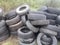 Unauthorized dumping of old car tires on the outskirts of the city