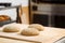 Unbaked bread loaves on board