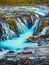 Unbelievable summer scenery. Azure water Bruarfoss Waterfall, secluded spot with cascading pure waters.