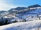 Unbelievably beautiful winter atmosphere on the pastures and hills of the Swiss Alps in the Obertoggenburg region, Unterwasser