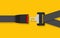 Unblocked driver and passengers seat belt with fastener and black strap on yellow background. Safety belt for protection