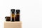 Unbranded amber bottles set for cosmetics, natural medicine, essential, massage oils or other liquids. Flacon on wooden