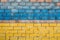 Unbreakable Will: Brick Wall Texture in Ukraine Flag Colors, Generative AI