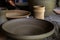 Unburned clay vessels on table