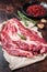 Unccoked marble black angus meat Steak on kitchen table, beef chuck roll steak. Dark background. Top view