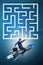 The uncertainty concept with businessman lost in maze labyrinth