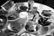 Uncleaned dining table with plates, and mugs and food