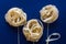 Uncooced italian pasta fettuccine. Pasta flowers on a classic blue background