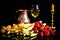 Uncooked asparagus, potatos and strawberries in front of a black background, with a glass of wine, a jar and a candle, like a stil