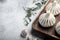 Uncooked Baozi chinese dumplings. Azian dumplings, on gray stone background, with copy space for text