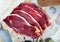 uncooked beef marbled steak served with pepper on the table