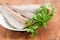 Uncooked carcasses of the Alaska pollock with parsley closeup