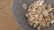 Uncooked cereal puffed spelt wheat fall and fill a gray bowl