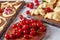 Uncooked cherry dumplings on a wooden board