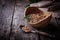 Uncooked chick-peas on wooden bowl