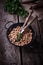 Uncooked chick-peas on wooden bowl