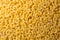 Uncooked Chifferi Rigati Pasta Background