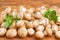 Uncooked edible mushrooms on a wooden surface