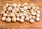 Uncooked edible mushrooms on a wooden surface