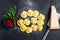 Uncooked fresh ravioli. Home Italian cuisine. Black background. Top view