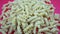 Uncooked fusilini pasta pieces close panorama to right side