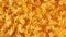 Uncooked fusilli pasta, dry spiral macaroni background rotation