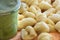 Uncooked gnocchi and jar of pesto