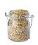 Uncooked green buckwheat grains in jar isolated