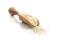 Uncooked indian long rice in wooden scoop