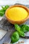 Uncooked Italian polenta in a wooden bowl