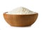 uncooked jasmine rice in wooden bowl isolated