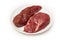 Uncooked kangaroo meat steaks