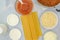 Uncooked lasagna pasta, cheese in the assortment, marinara sauce and ground beef, ingredients for beef lasagna recipe