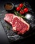 Uncooked meat steak on a black background. AI generated