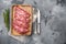 Uncooked  minced meat beef burger cutlets, on gray stone table background, top view flat lay, with copy space for text