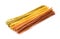Uncooked multicolored  long ribbon pasta