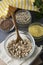 Uncooked oatmeals with various uncooked cereals on gray background, top view, close up. Healthy nutrition food